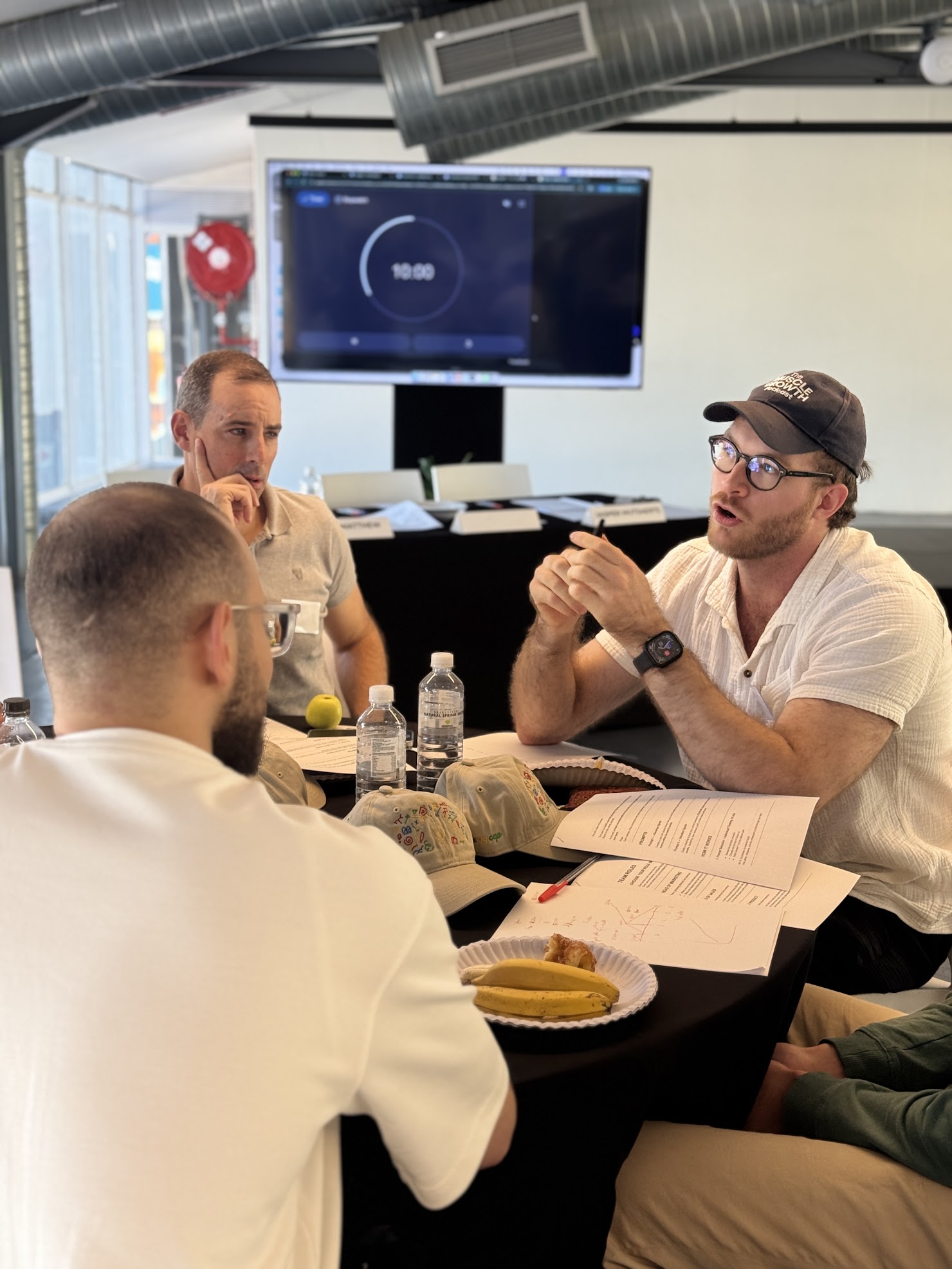 Founders discussing ideas around a table